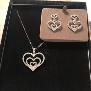 Nolan Miller Gracious Heart Enhancer with chain and matching post earrings.